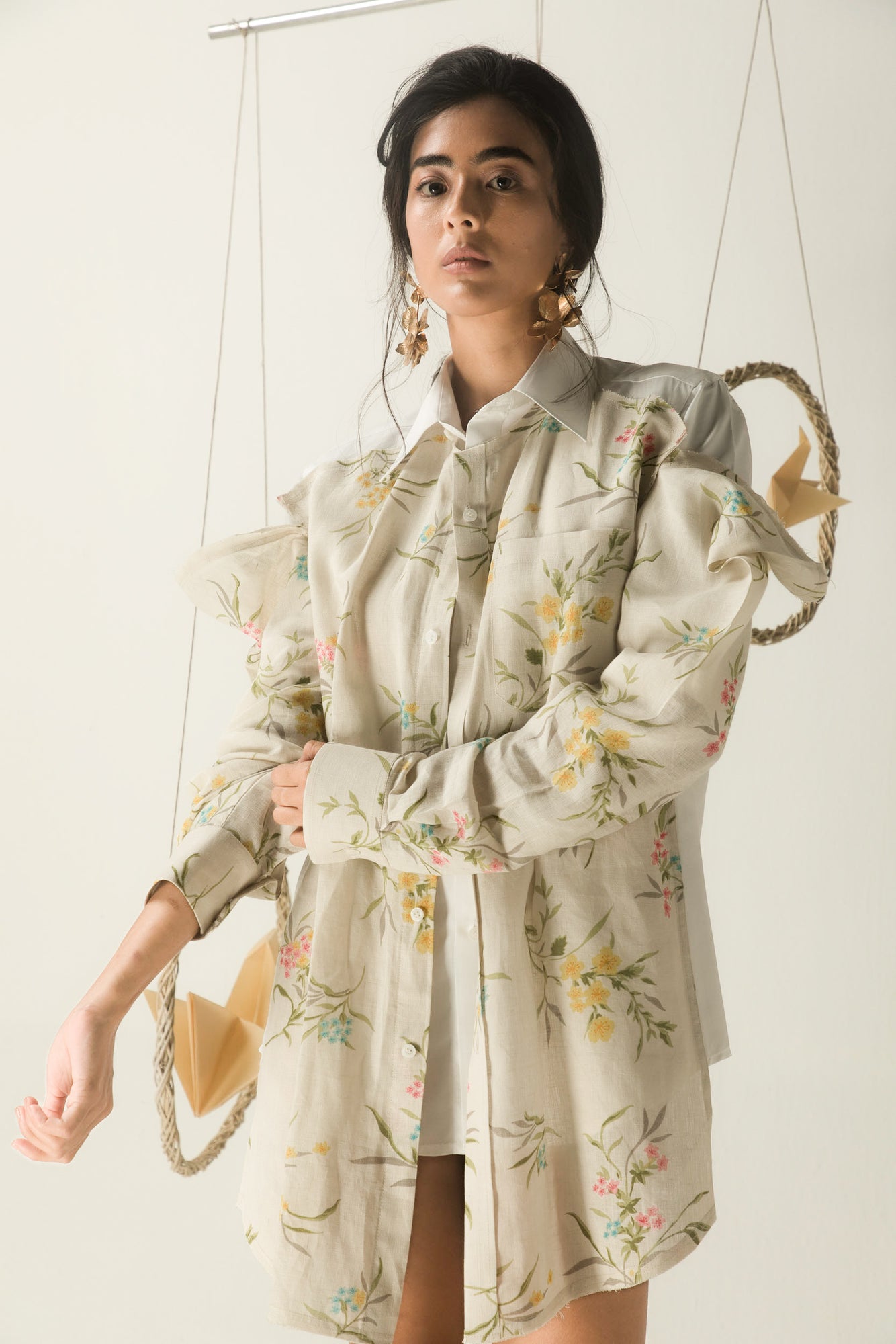 Luxury womenswear shirt in beige and white, handcrafted from organic linen and cotton, featuring lace details and a pleated yoke