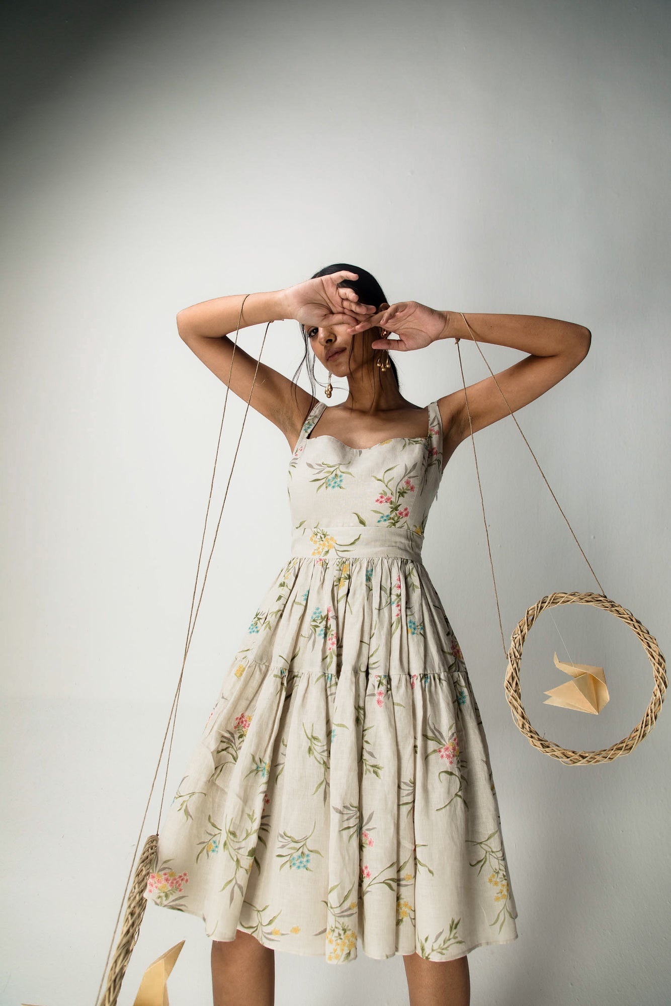 Beige cotton linen dress with broad straps, fitted neckline, A-line silhouette; handcrafted luxury womenswear with natural style