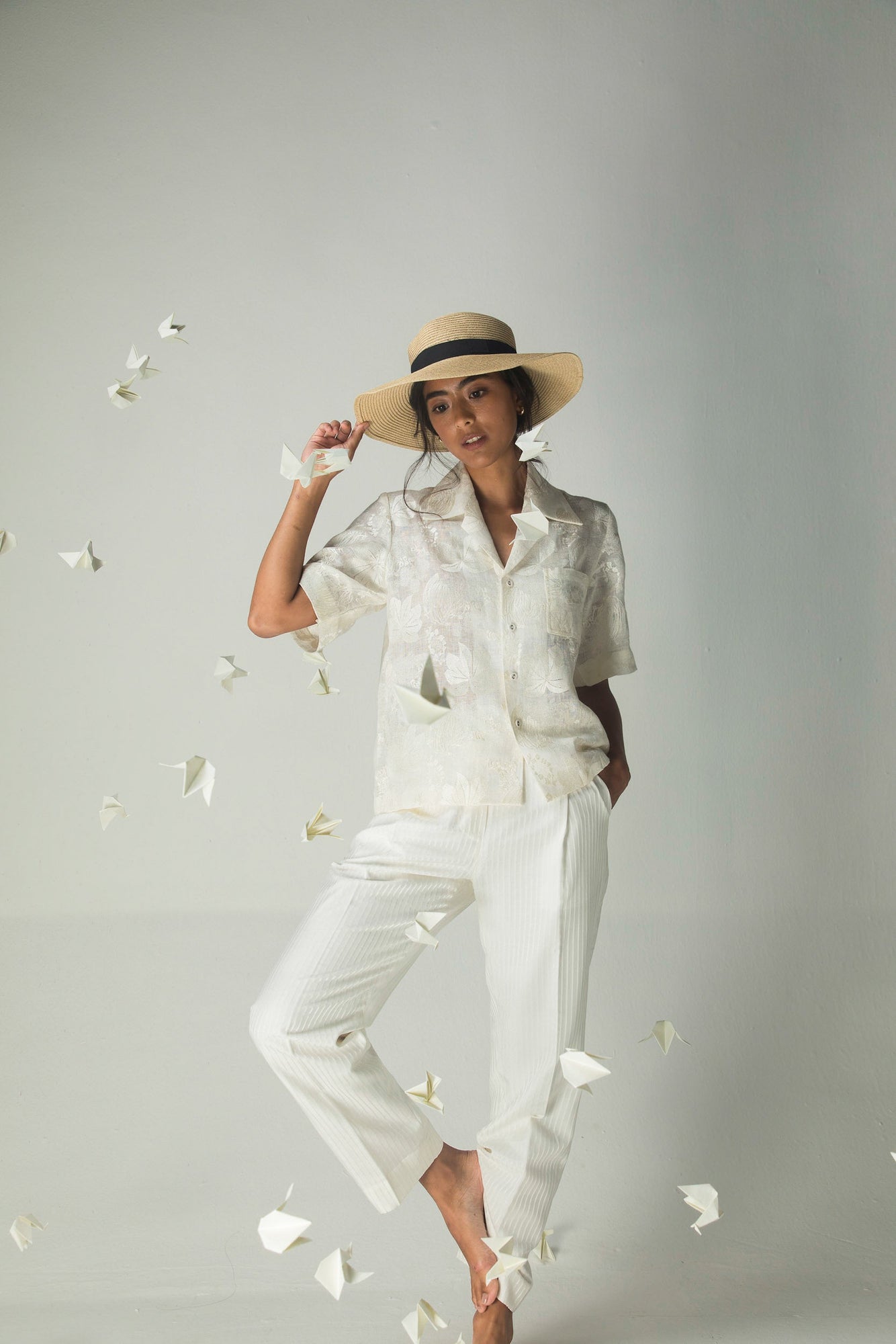 Luxurious white linen silk jacquard trousers, relaxed straight fit with pockets, artisan-crafted for comfort and elegance in womenswear