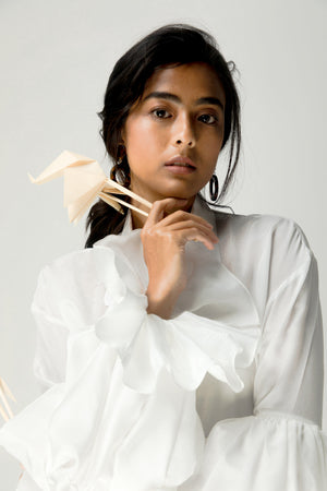 White luxury women's shirt with lace-detailed placket and collar, crafted from taffeta and crepe silk, showcasing a pleated yoke panel