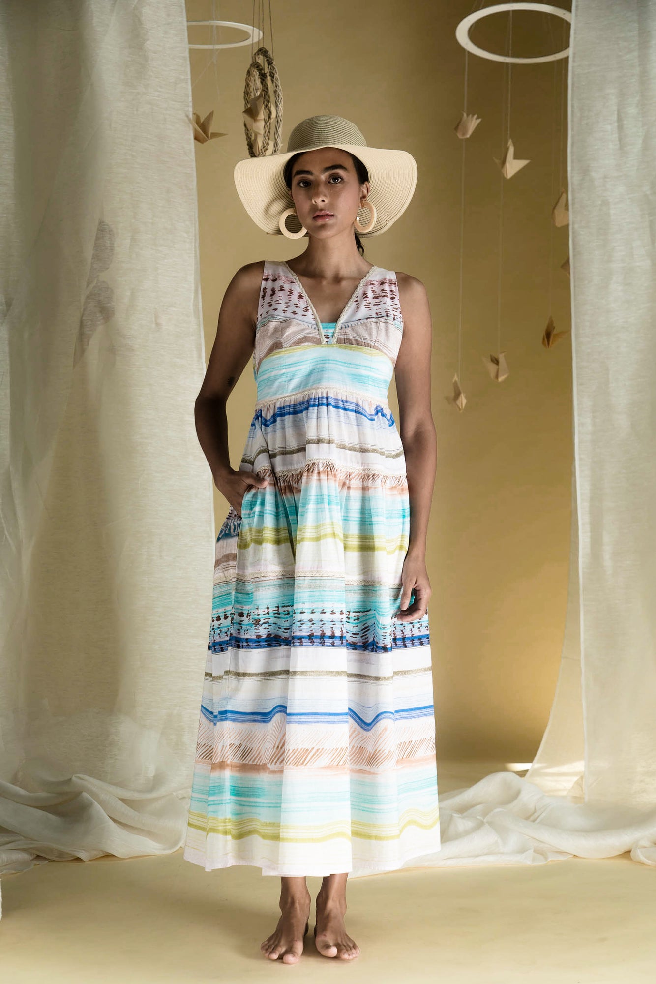 Sleeveless long dress in pastel multicolor print, crafted from cotton cambric with a V-neck bustier and ankle-length straight silhouette