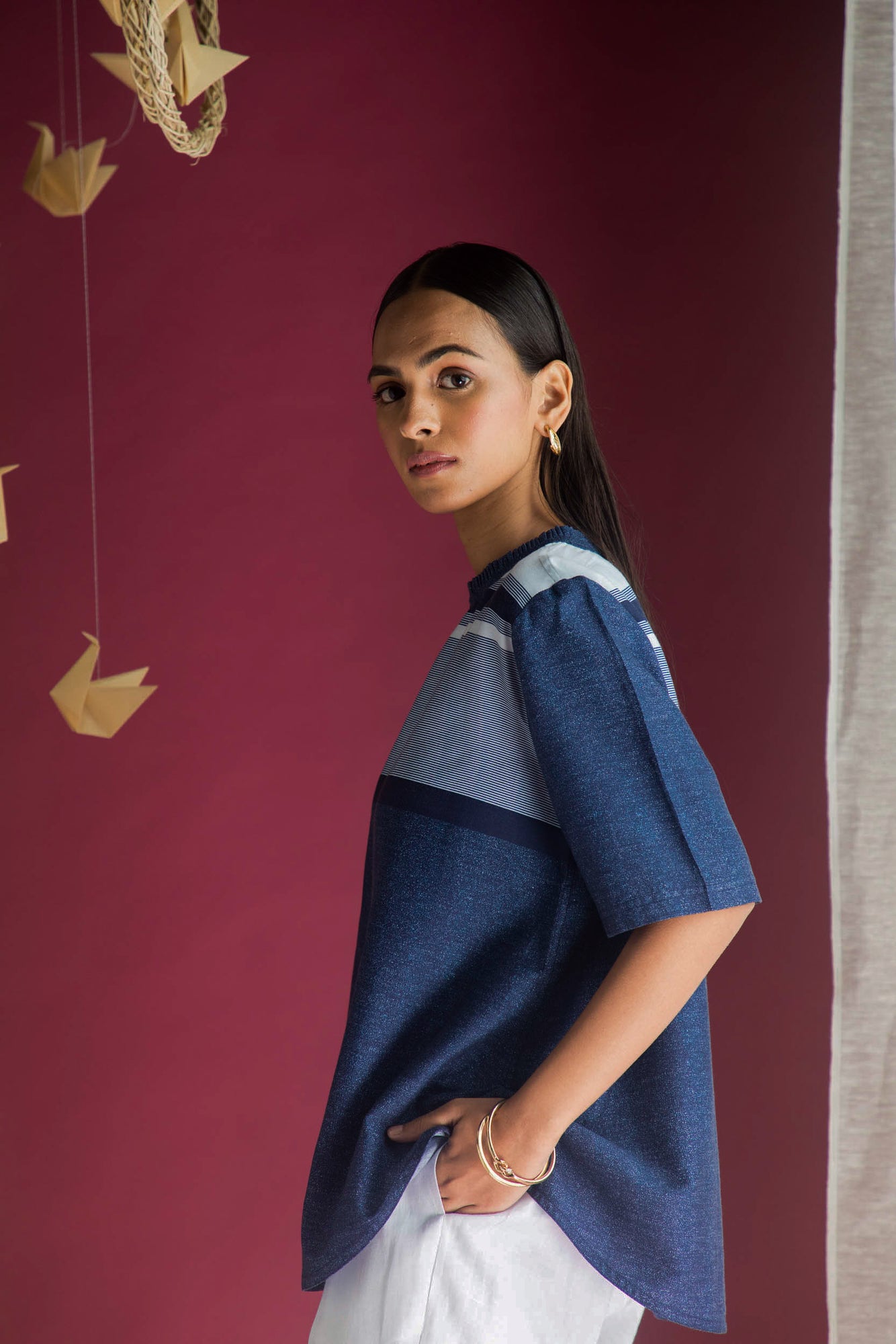 Luxurious loose-fitted top in cotton yarn dyed fabric, featuring elbow-length sleeves in shades of blue, denim, and white, artisan-crafted