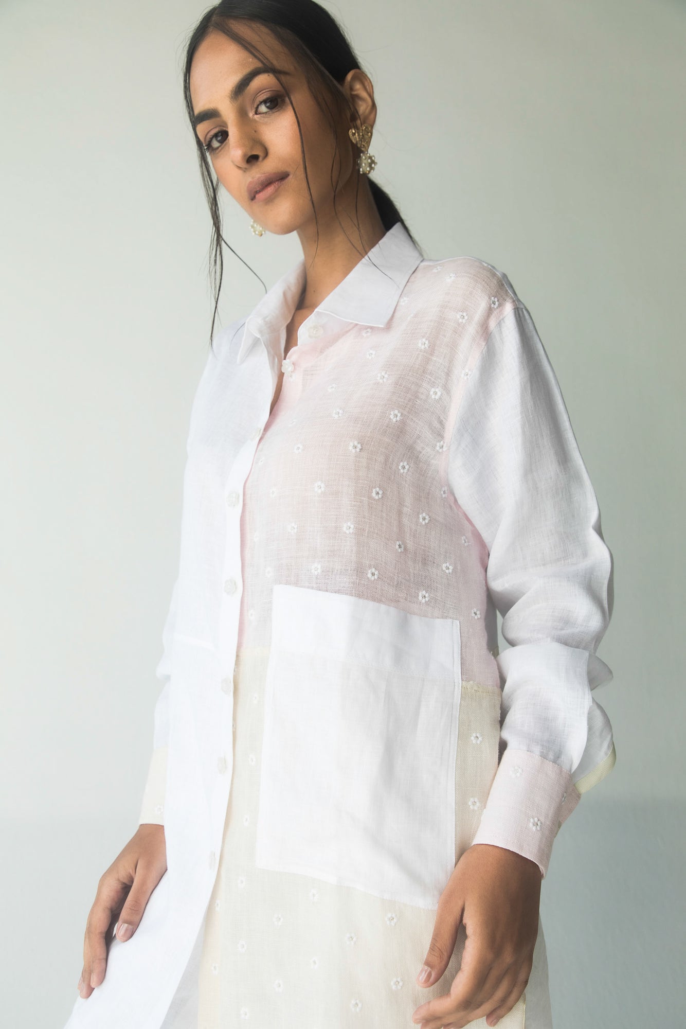 Handcrafted loose-fit shirt in embroidered linen and Italian white linen, featuring a white and pink palette, luxury womenswear