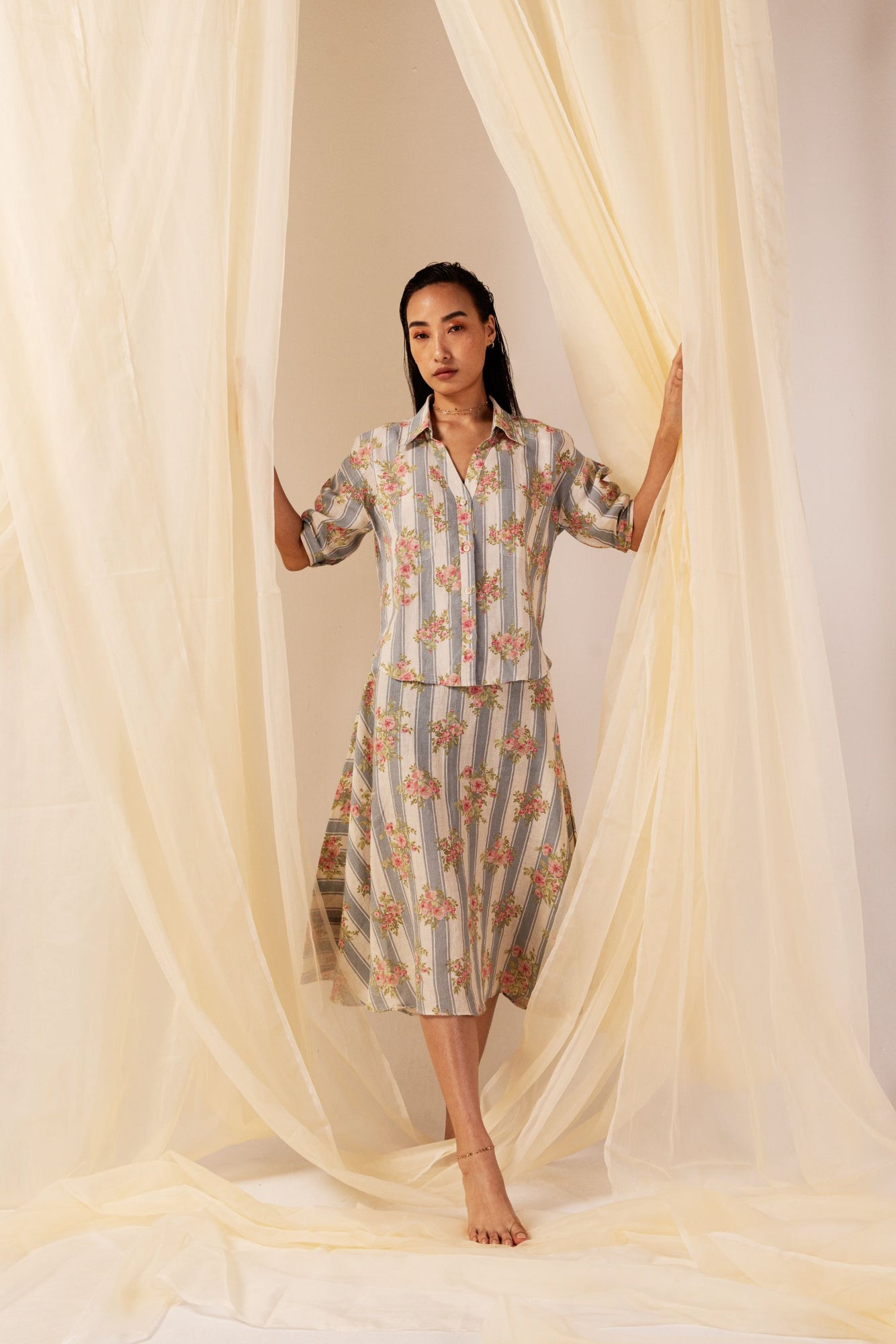 Luxurious floral stripe linen shirt with crisp collar, drop shoulders, and short sleeves, showcasing artisan craftsmanship and elegance