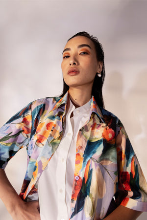 Luxury women's half-sleeve shirt with dual layers; white Italian cotton inner and printed outer, classic collar, button closure; artisan-made
