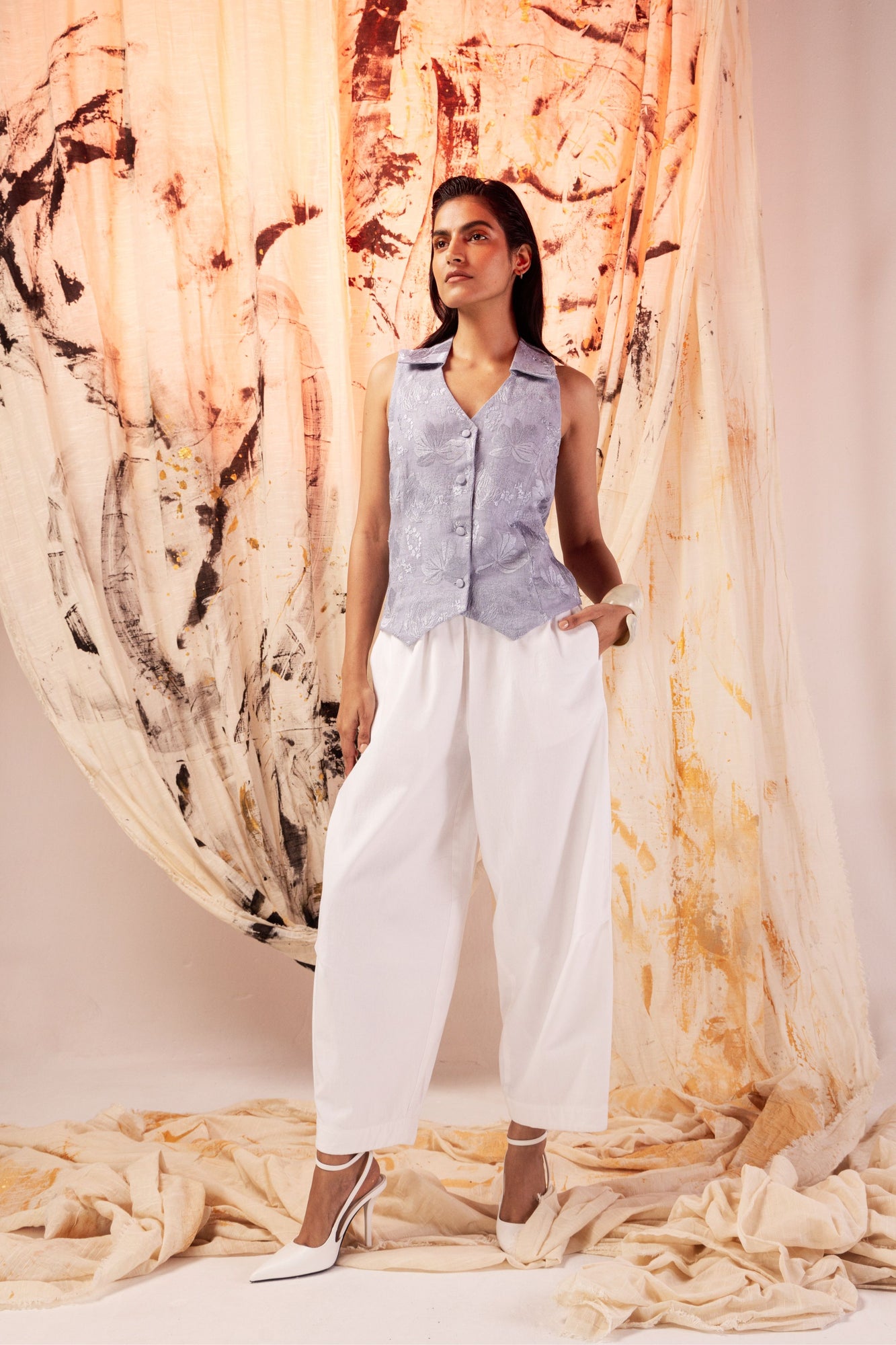 Sleeveless milk-white linen top with waistcoat cut, normal collar, pearl buttons; handcrafted luxury womenswear by NJ3 Atelier
