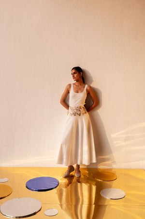 Luxurious gold cotton poplin skirt with floral embroidery on waistband, flared silhouette, artisan-made in India, side zip closure