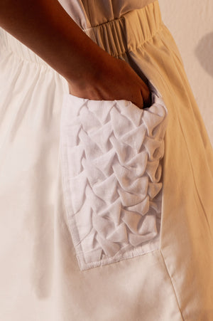 Floral stripe linen shorts with origami smocking, elasticated waist, and functional pockets; artisan-made luxury womenswear