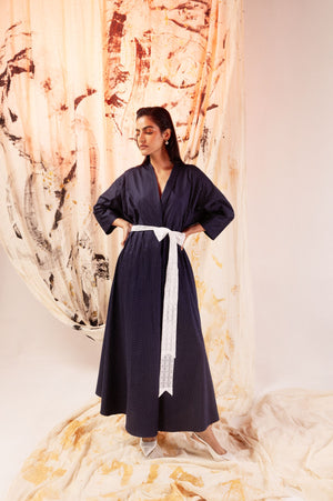 Luxurious blue polka dot sateen dress with kimono sleeves, V-neck, lace belt, and crystal embellishments, crafted in India