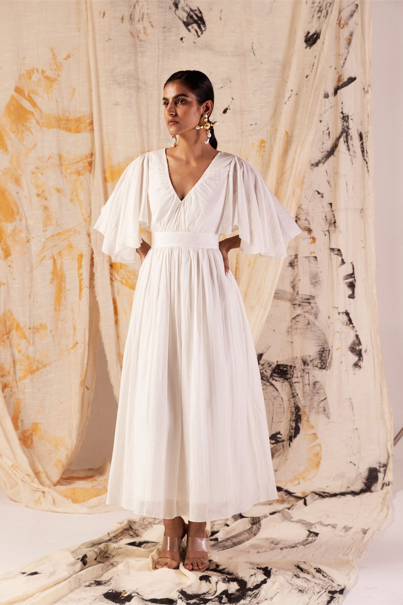 Elegant long dress in sustainable orange peel fabric, V-neck, pin-tucked pleats, Japanese crystal embellishments, artisan-made luxury