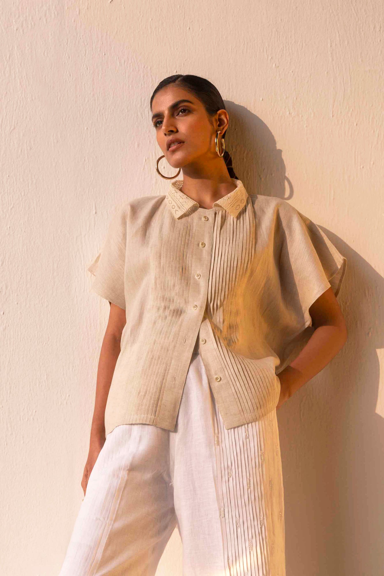 Beige linen shirt with lace-trimmed collar, pin tuck details, and half sleeves; artisan-made luxury womenswear, perfect for effortless elegance
