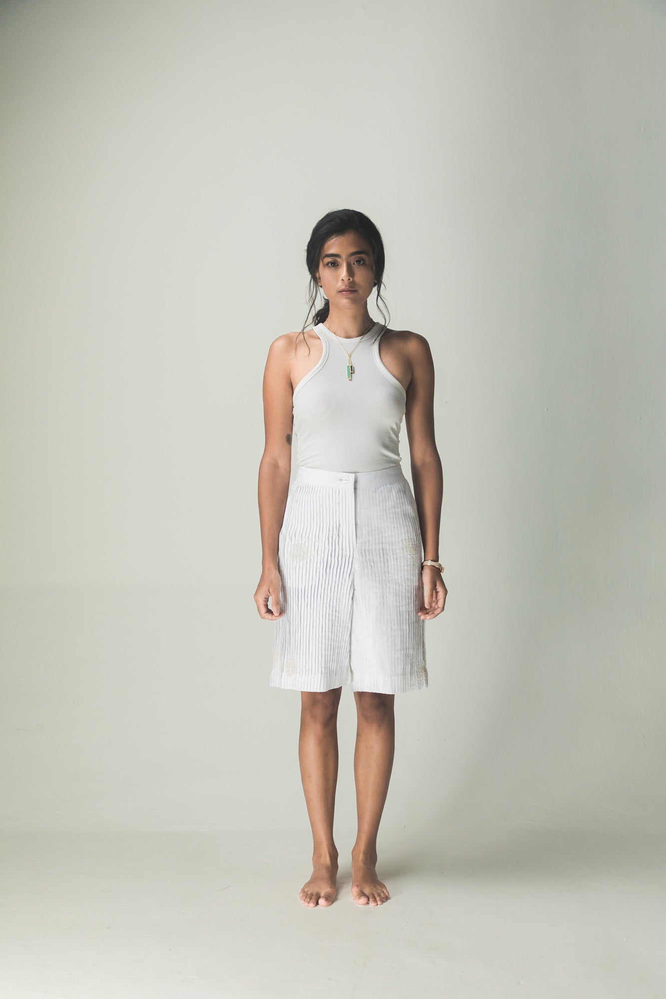 Luxurious handloom pleat-sum shorts in rich navy, showcasing exquisite craftsmanship and premium fabric for discerning tastes