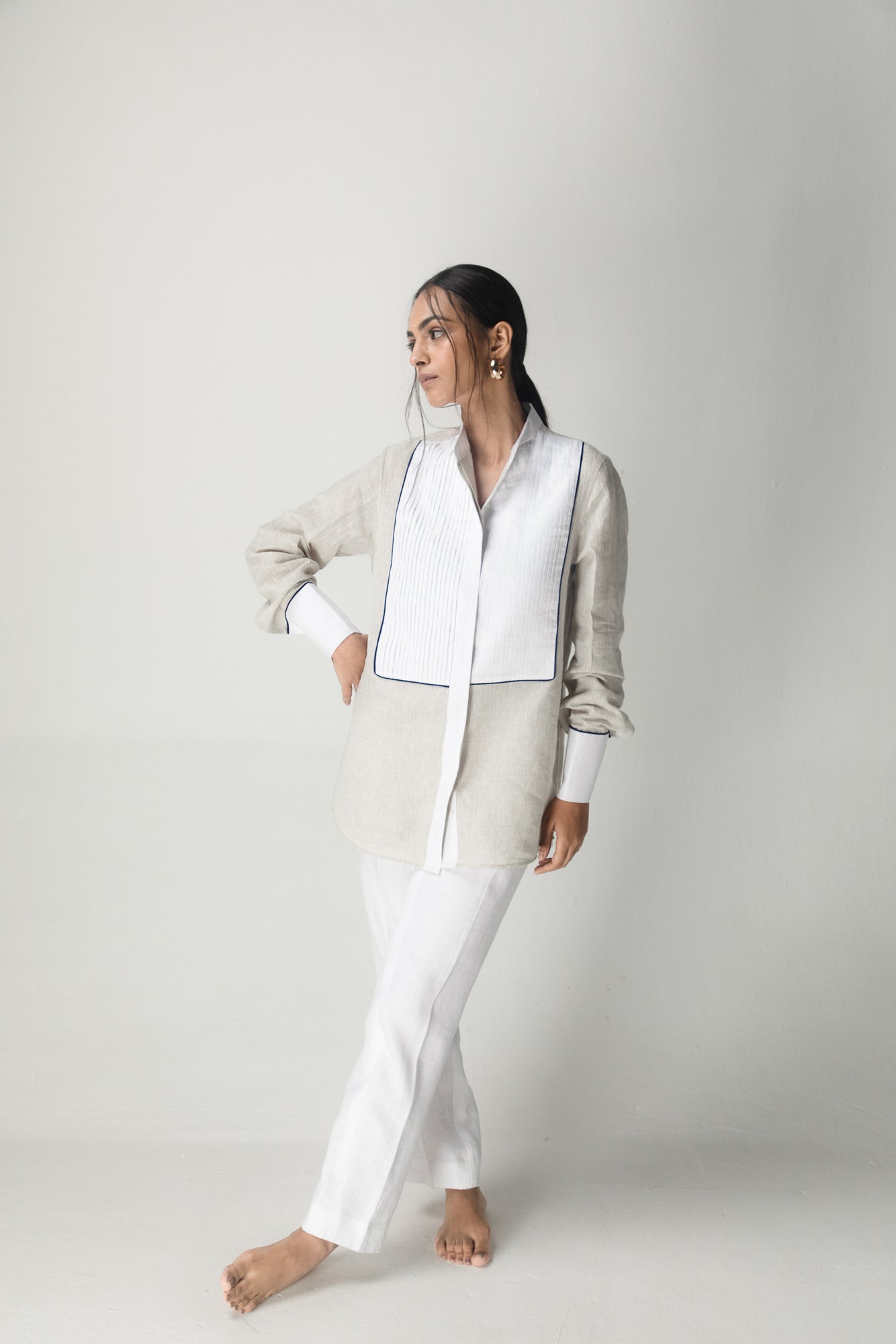 Elegant handloom shirt in rich brick hue, showcasing premium fabric and timeless silhouette, epitomizing luxury womenswear craftsmanship