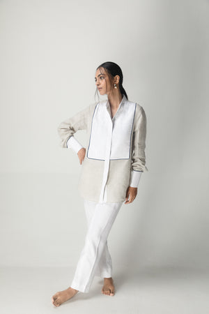 Elegant handloom shirt in rich brick hue, showcasing premium fabric and timeless silhouette, epitomizing luxury womenswear craftsmanship