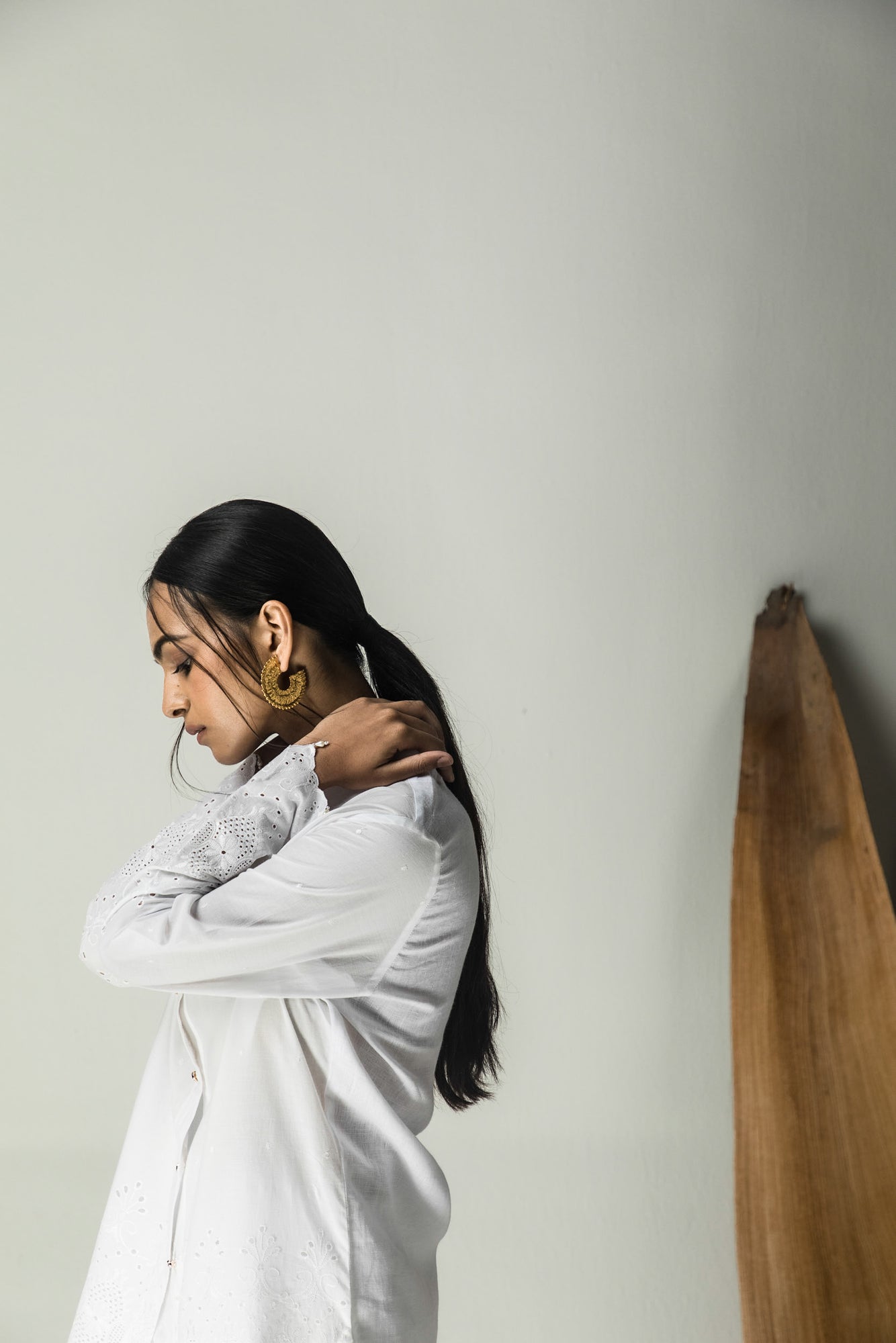 Milky white handloom shirt in premium fabric, showcasing exquisite artisan craftsmanship and luxury womenswear elegance
