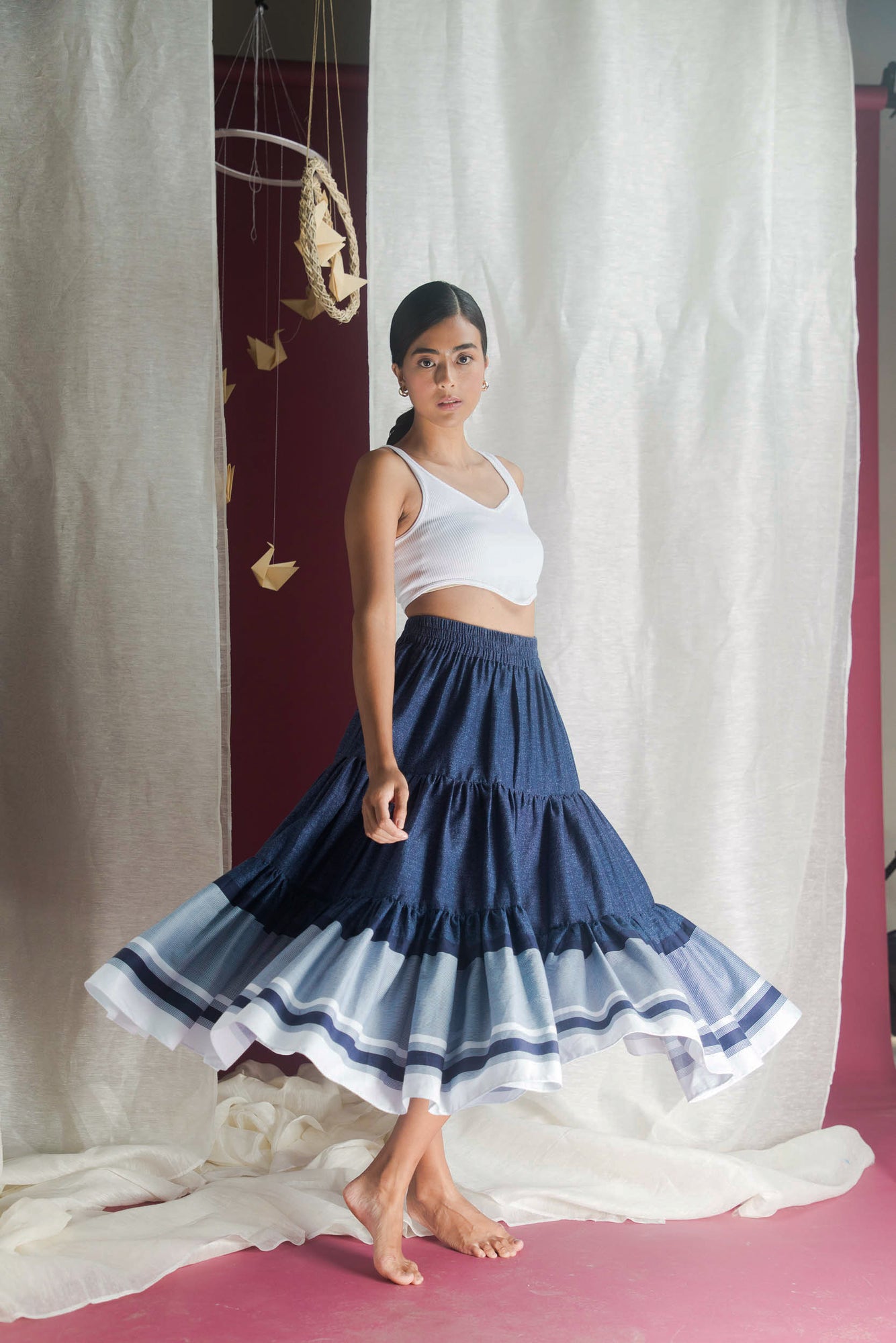 Handcrafted crystal-clear skirt in premium fabric, showcasing luxury womenswear with an elegant silhouette and artisan detailing