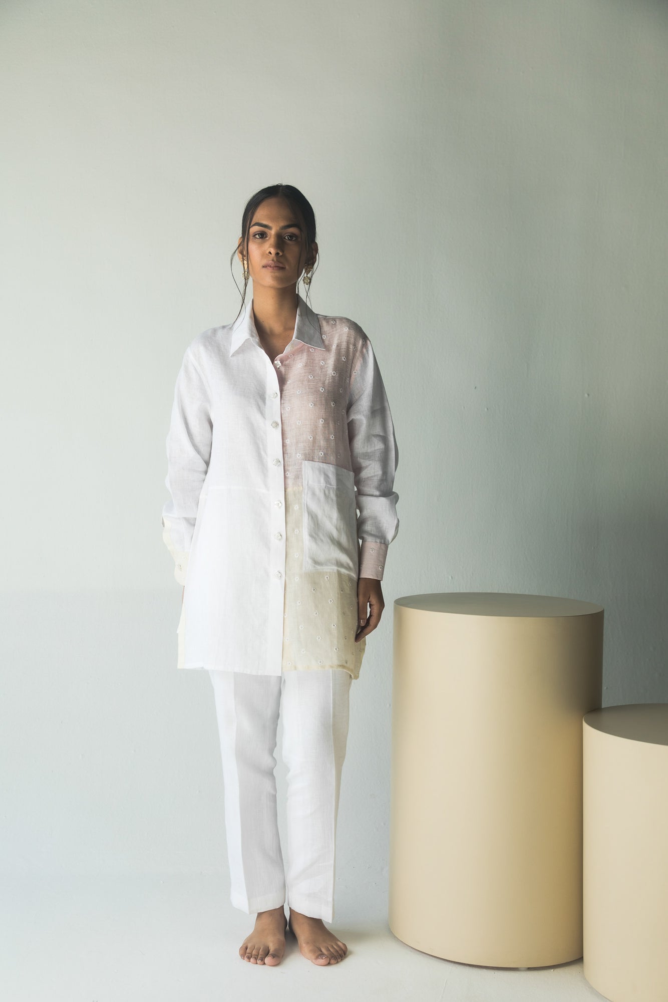 Elegant white shirt in premium handloom fabric, showcasing artisan craftsmanship with a tailored silhouette for luxury womenswear