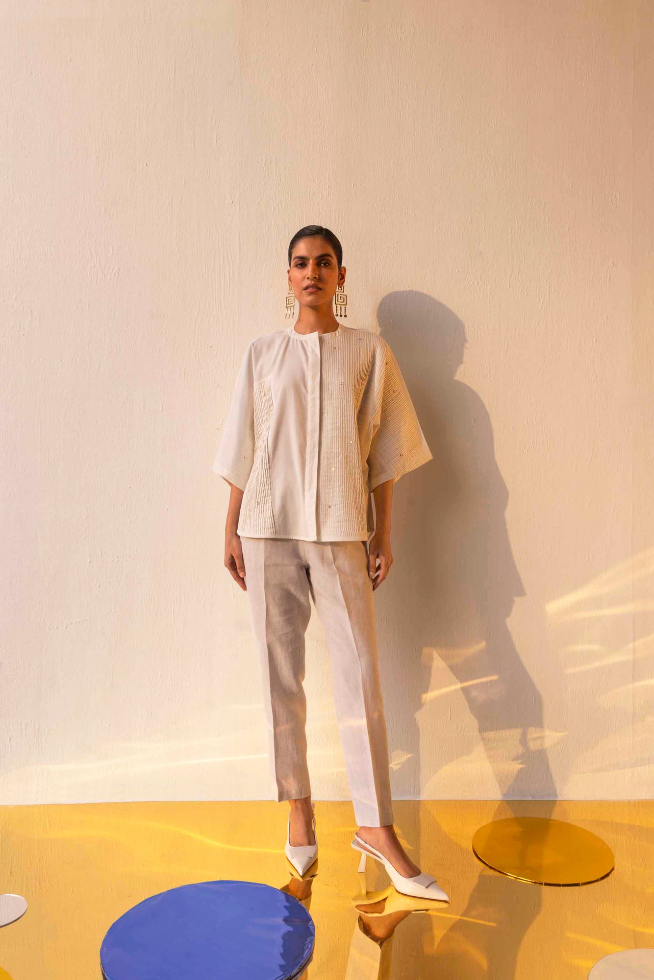 Elegant handloom Blanca Pleated Shirt in soft ivory, showcasing intricate pleats and a refined silhouette, epitomizing luxury womenswear