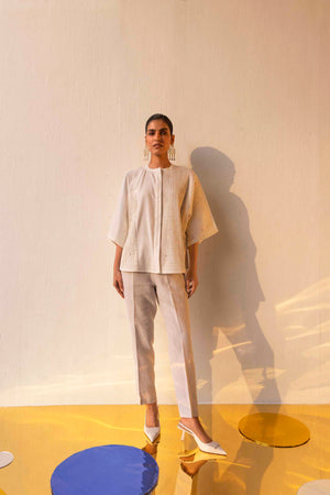 Elegant handloom Blanca Pleated Shirt in soft ivory, showcasing intricate pleats and a refined silhouette, epitomizing luxury womenswear