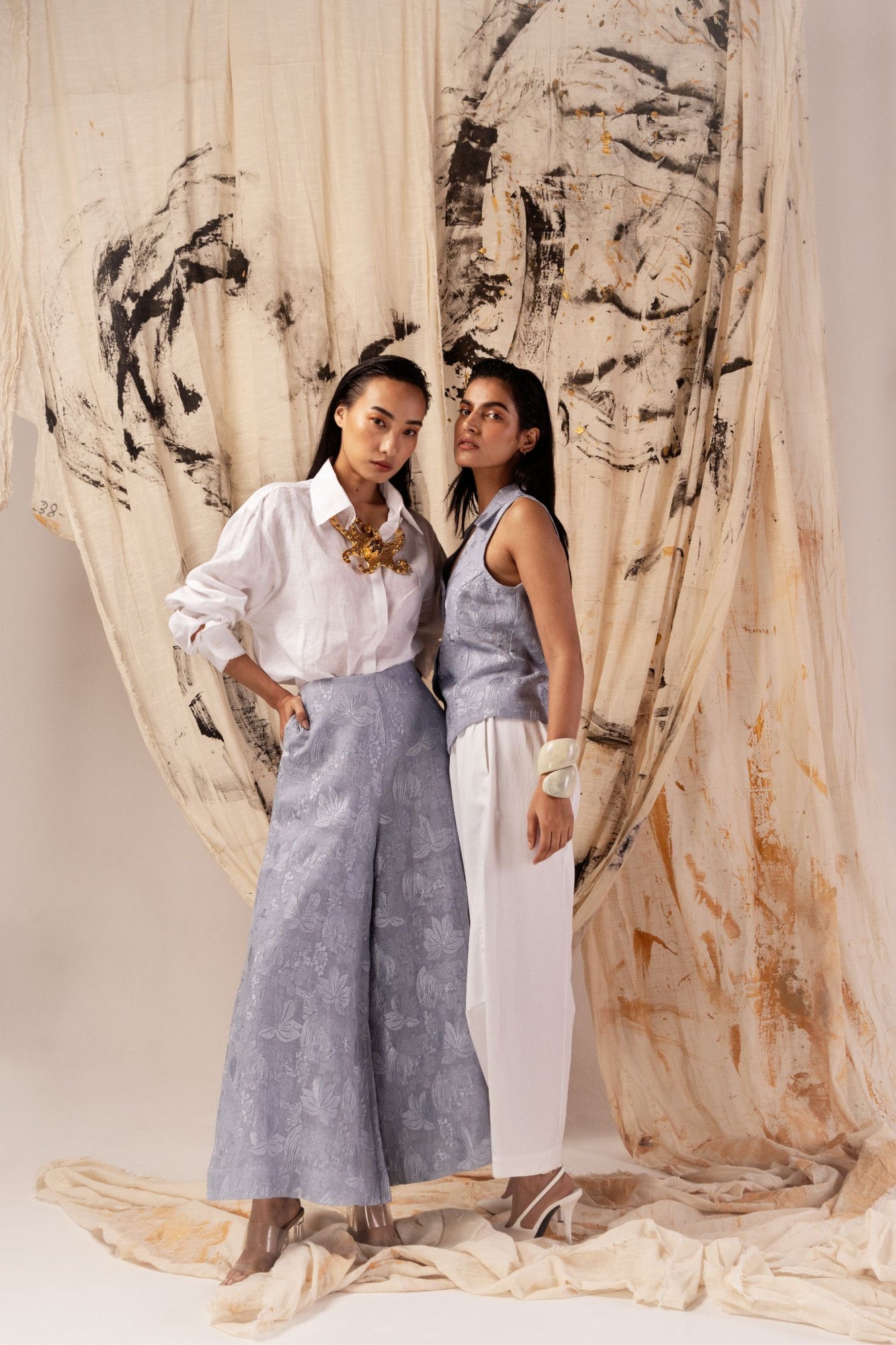 Powder blue flared pants in premium handloom fabric, showcasing a sophisticated silhouette and artisan craftsmanship by NJ3 Atelier