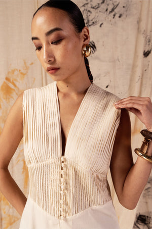 Petal yellow pleated dress in premium fabric, showcasing luxury womenswear with an elegant silhouette and artisan craftsmanship