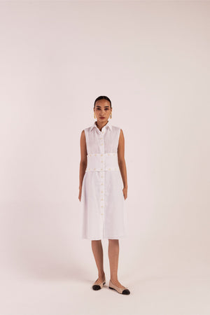 Handcrafted luxury linen dress in a soft blue hue, featuring a flowing silhouette and artisan detailing, epitomizing elegant womenswear