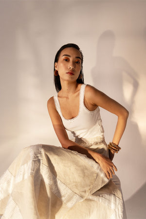 Almond beige skirt with elegant tucks, handcrafted from premium fabric, exemplifying luxury womenswear by NJ3 Atelier