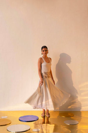 Elegant gold skirt with flowing silhouette, crafted from premium handloom fabric, epitomizing luxury womenswear by NJ3 Atelier