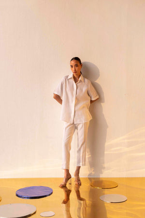Handcrafted rich gold linen shirt with premium fabric, showcasing luxury womenswear style and artisan-made elegance