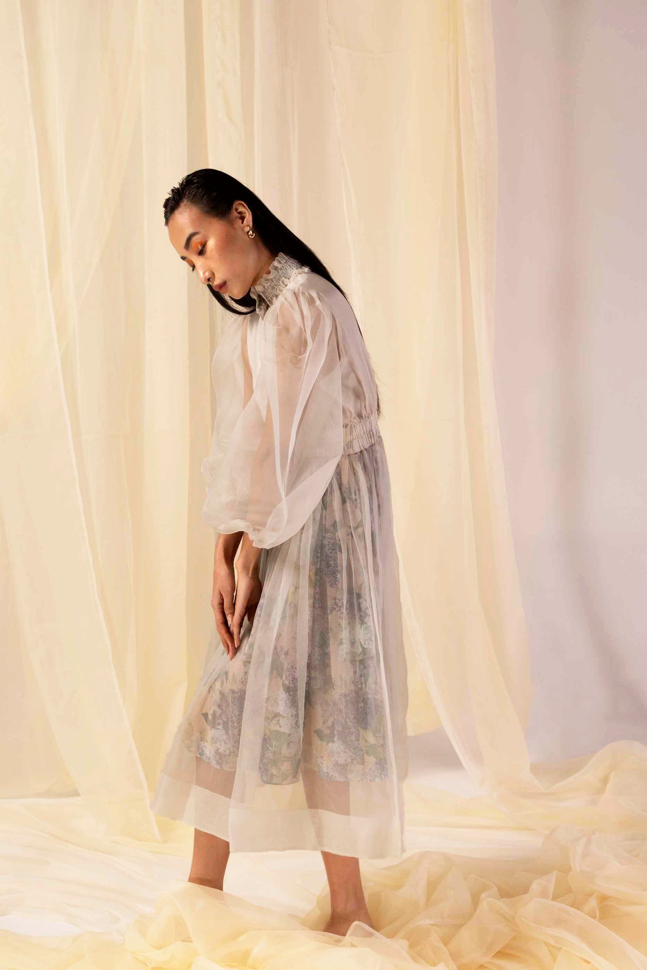 Luxurious moss green dress in premium handloom fabric, showcasing a sophisticated silhouette with artisan-crafted details