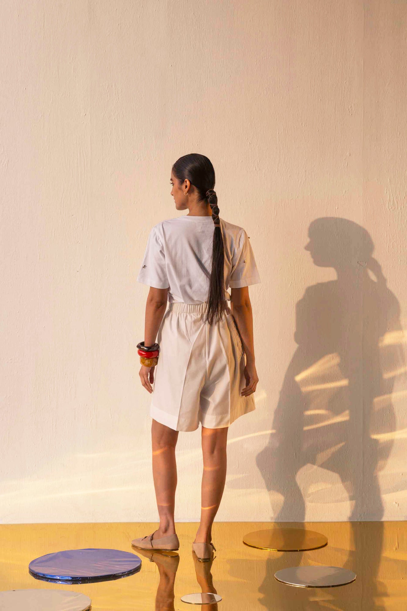 "Elegant white t-shirt in premium handloom fabric, showcasing NJ3 Atelier's artisan craftsmanship and luxury womenswear design."