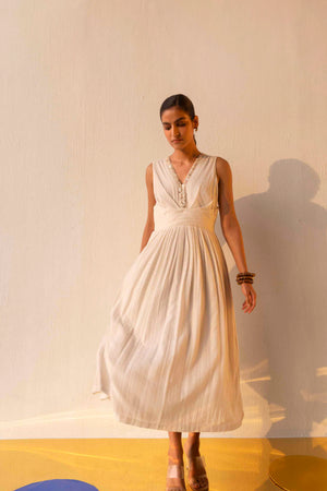 Elegant milky-white gauze dress with delicate dot pattern, showcasing NJ3 Atelier's artisan craftsmanship and luxury womenswear design