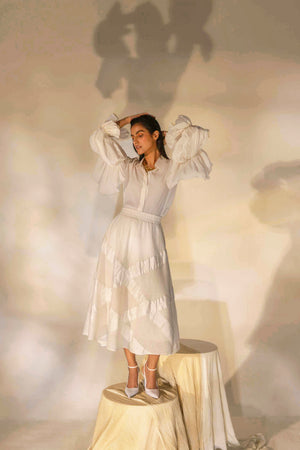 Pearl white skirt in premium handloom fabric, showcasing a refined silhouette with artisan-crafted tucks for a luxurious touch