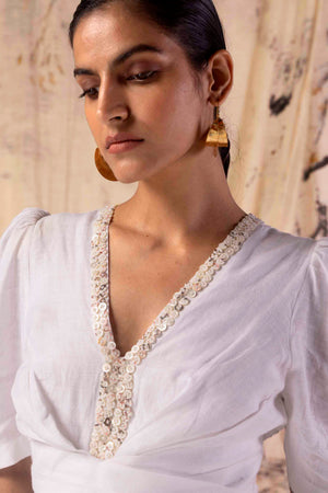 Elegant paper-white linen dress, handloomed with premium fabric, showcasing a tailored silhouette and artisan craftsmanship