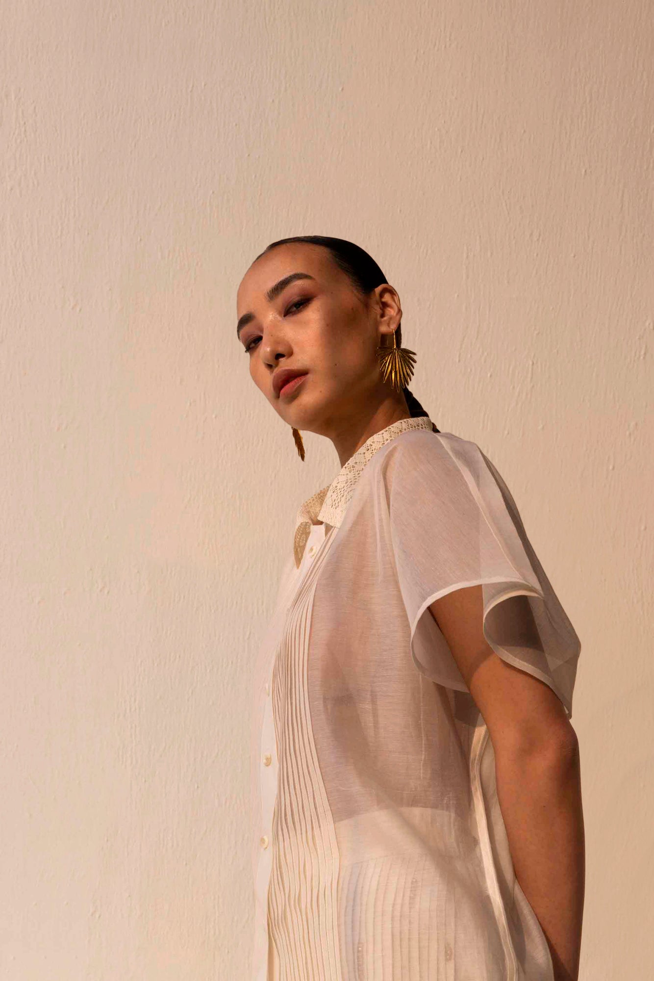 Elegant lace sheer shirt in premium handloom fabric, showcasing intricate artisan craftsmanship and luxury womenswear design
