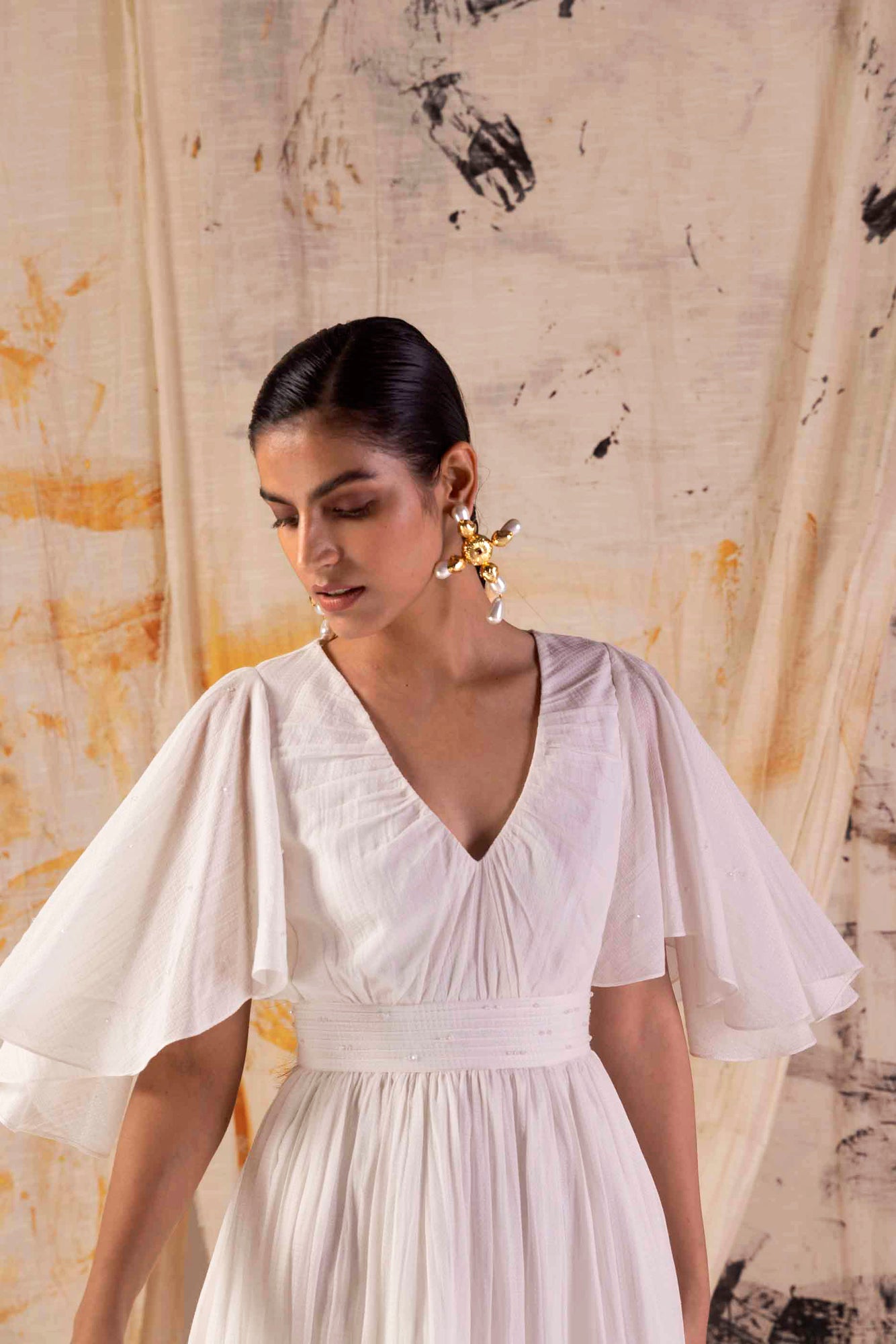 Elegant Valencia Fluid Dress in rich, handloom fabric, showcasing a flowing silhouette and luxurious craftsmanship, perfect for sophisticated occasions
