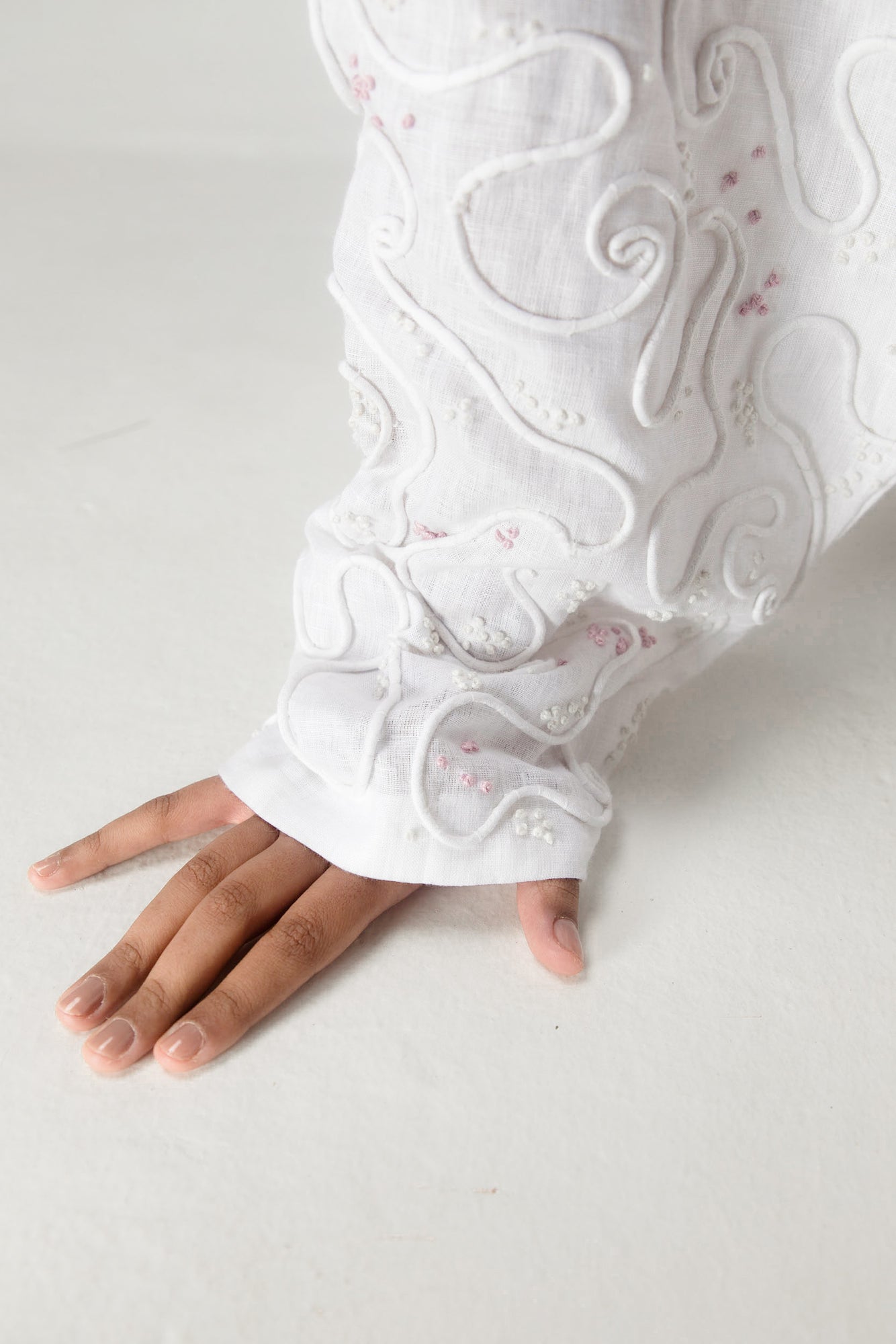 Elegant handcrafted dolman top in premium handloom fabric, showcasing a unique silhouette with intricate artisan detailing