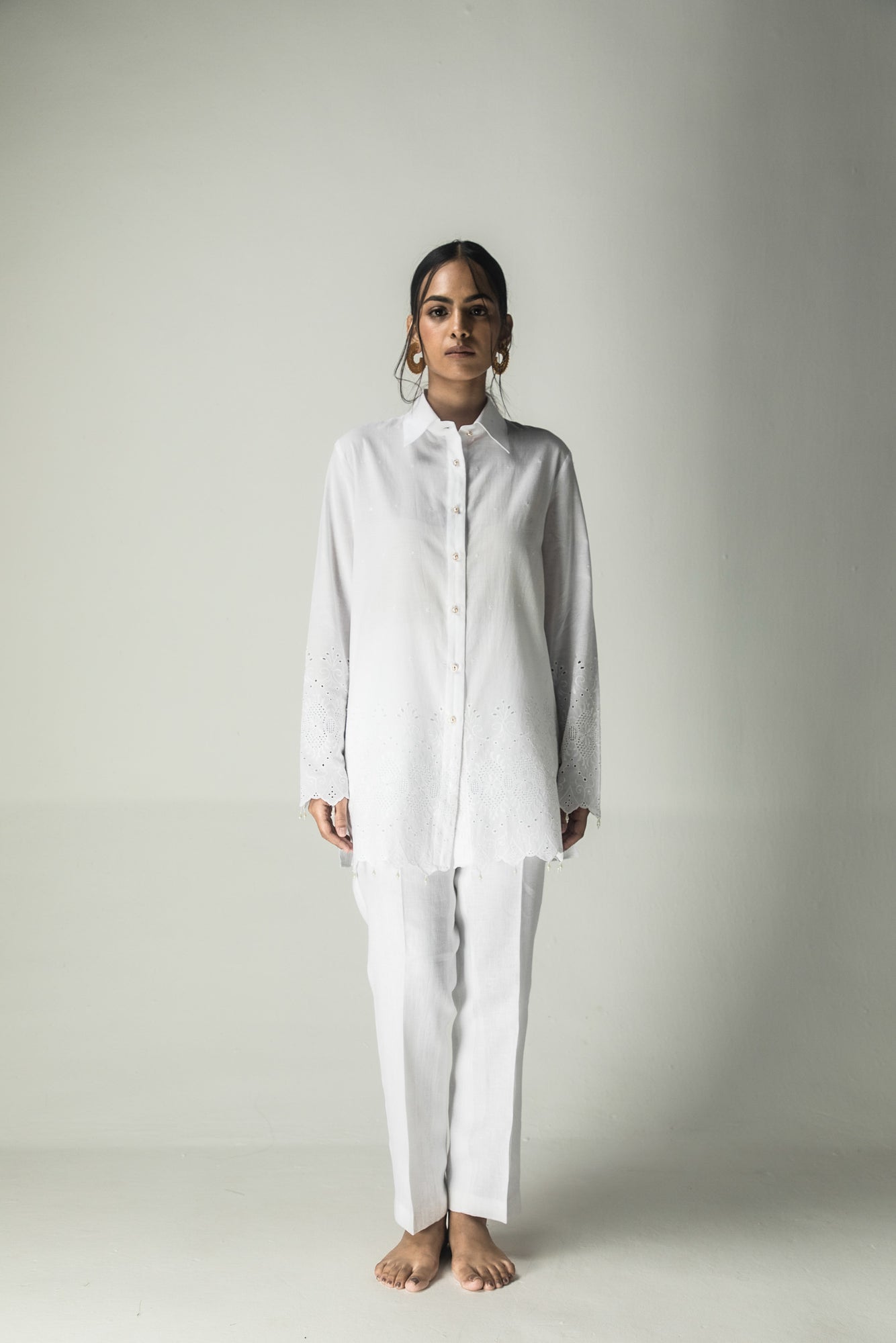 Elegant milky white shirt in premium handloom fabric, showcasing a tailored silhouette, epitomizing luxury womenswear craftsmanship