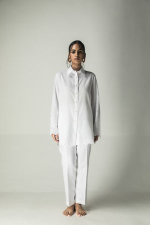 Elegant milky white shirt in premium handloom fabric, showcasing a tailored silhouette, epitomizing luxury womenswear craftsmanship