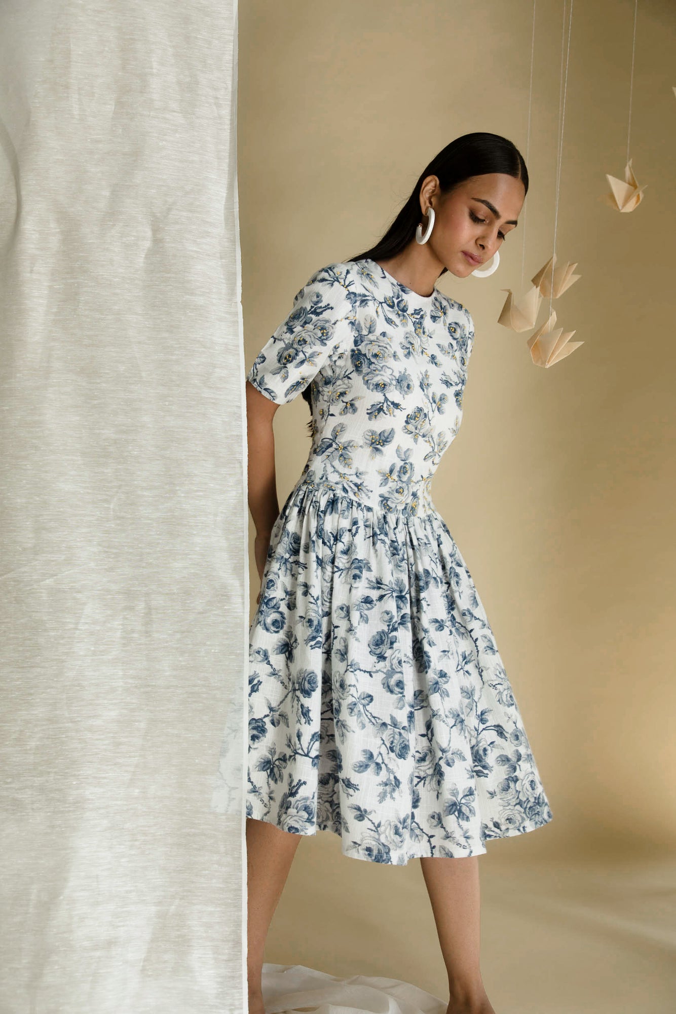 Elegant blue dress in premium handloom fabric, featuring a flowing silhouette and artisan craftsmanship, epitomizing luxury womenswear