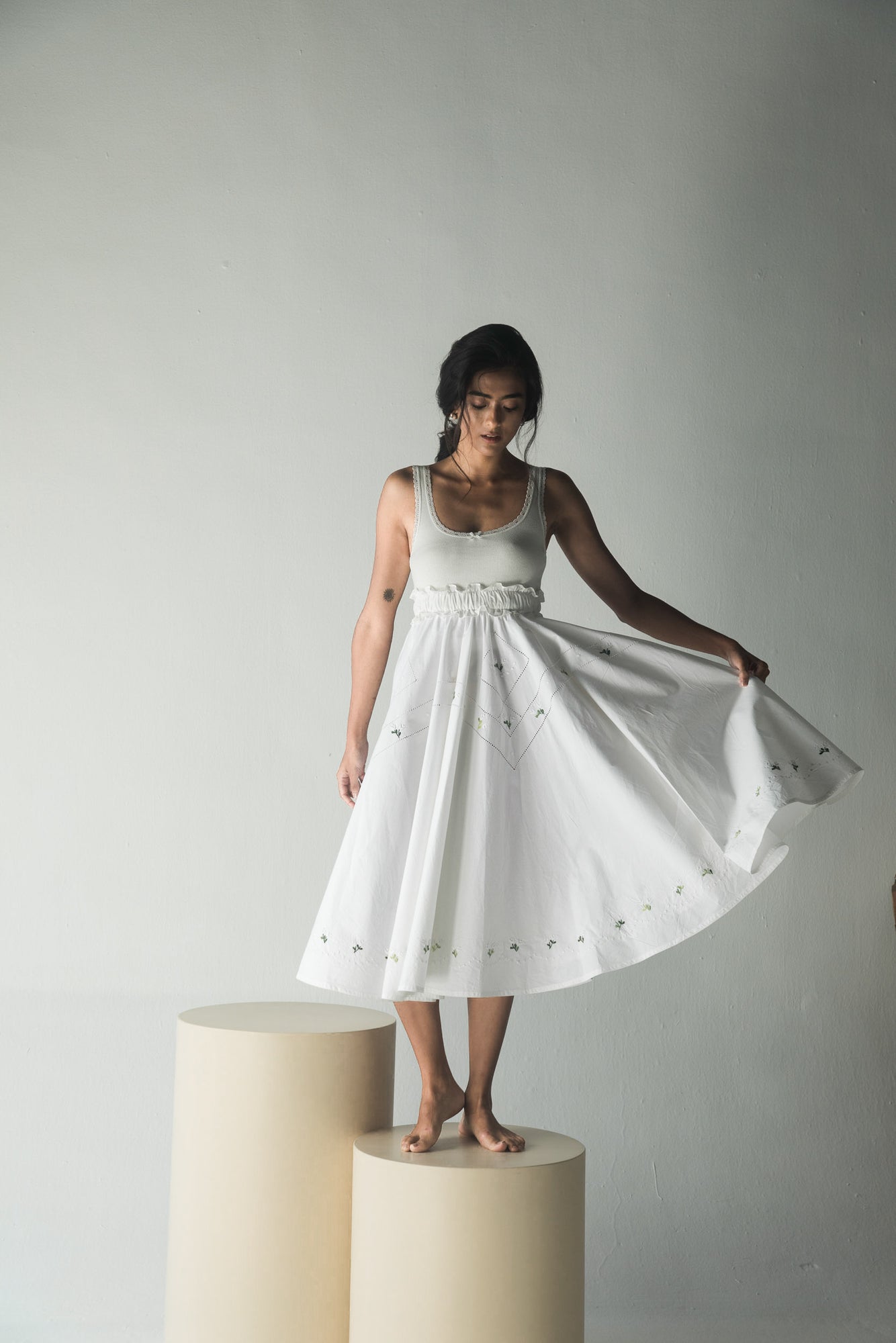 Elegant handcrafted paper short skirt in premium handloom fabric, showcasing a sophisticated silhouette in a rich, artisanal design