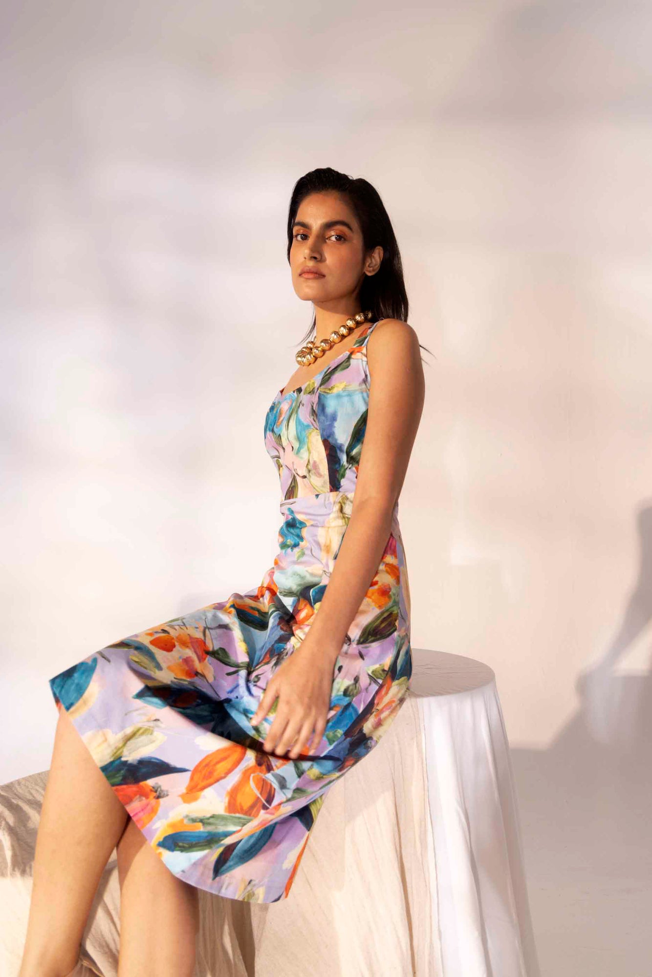 Elegant side view of the Millefleur Midi Dress in handloom fabric, showcasing its flowing silhouette and intricate artisan craftsmanship