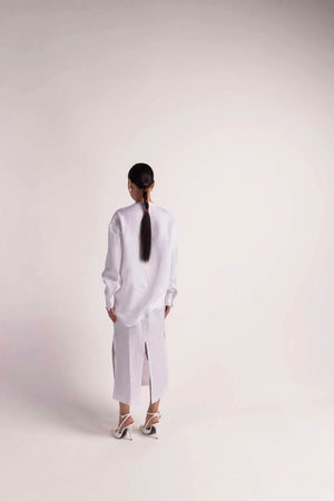 Elegant handloomed women's set in snowy white, showcasing premium fabric and artisan craftsmanship, epitomizing luxury womenswear