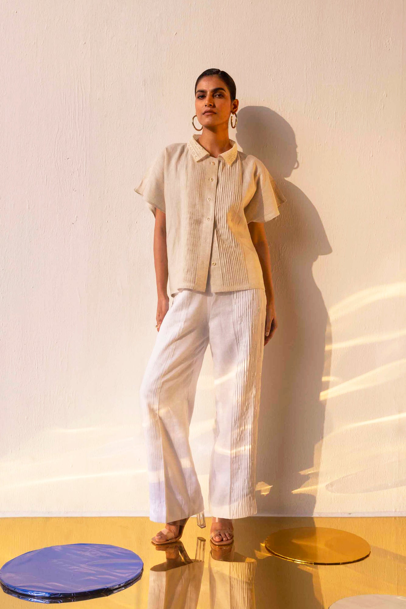 Elegant alabaster pleated trousers in premium handloom fabric, showcasing NJ3 Atelier's artisan craftsmanship and luxury design