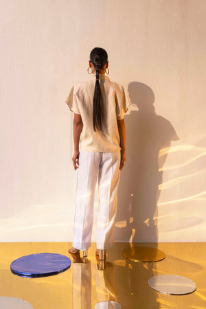 Elegant handloom linen shirt in soft pastel, showcasing artisan craftsmanship and premium fabric, epitomizing luxury womenswear