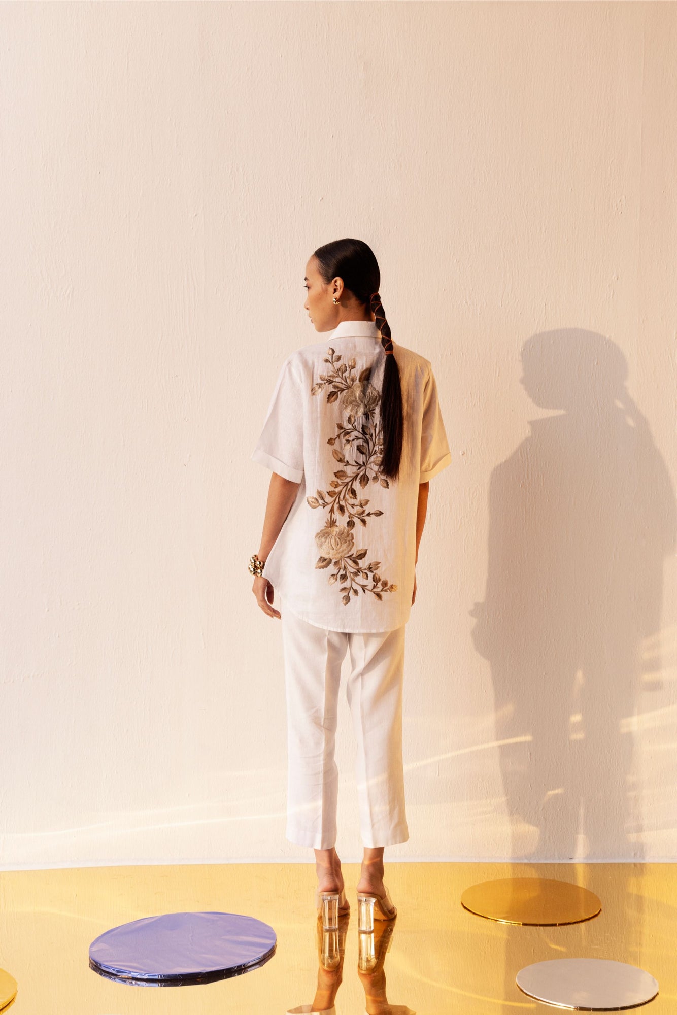 Rich gold handcrafted linen shirt with elegant silhouette, showcasing premium fabric and luxury artisan craftsmanship for sophisticated womenswear