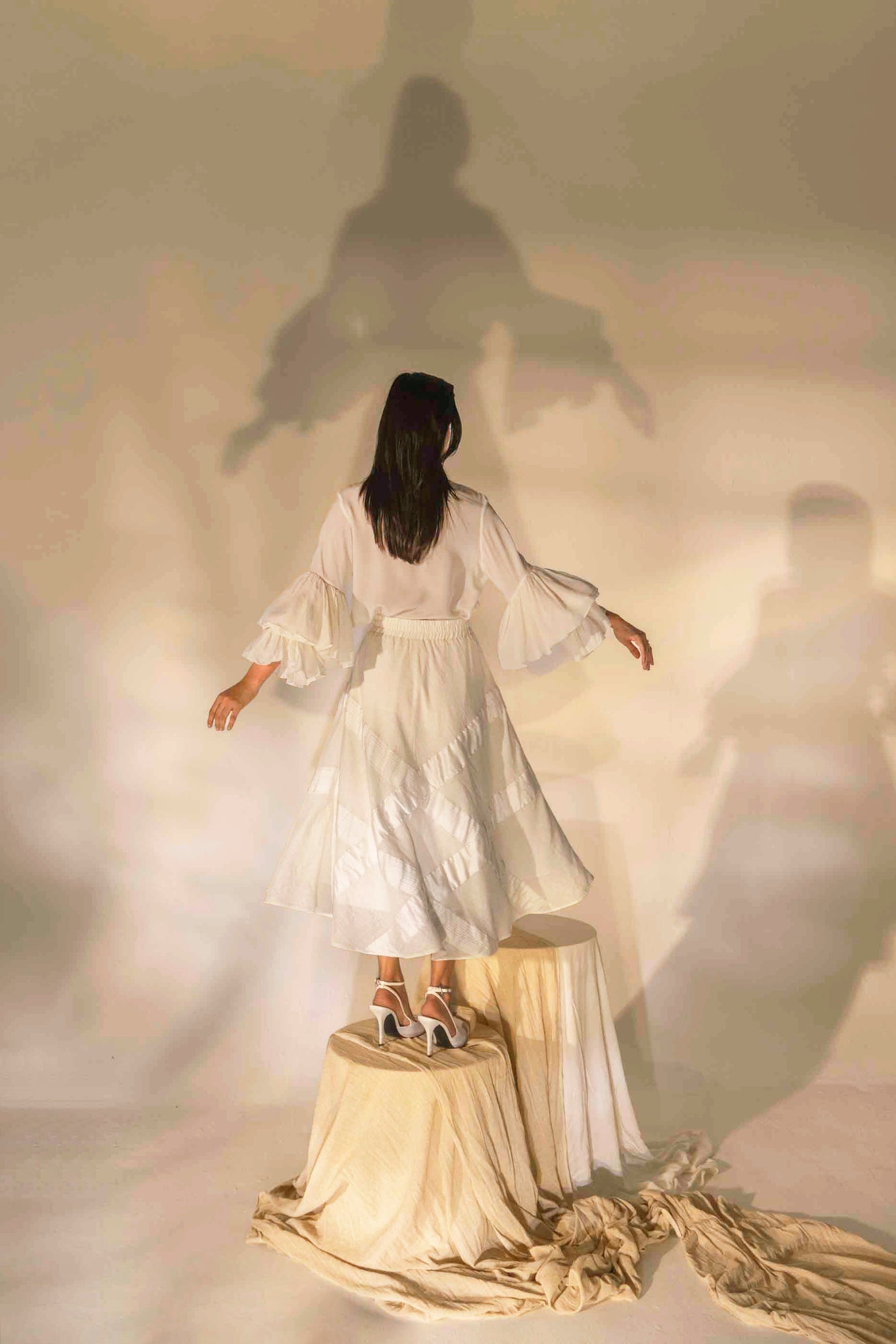 Elegant handloom pearl white skirt with a tailored tuck design, showcasing NJ3 Atelier's luxury artisan craftsmanship