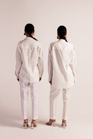 Close-up of NJ3 Atelier's artisan-made pinstripe paper white shirt, showcasing premium handloom fabric and elegant luxury womenswear design