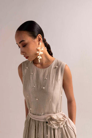 Elegant ivory linen dress with a flowing silhouette, showcasing NJ3 Atelier's artisan craftsmanship and luxury womenswear design