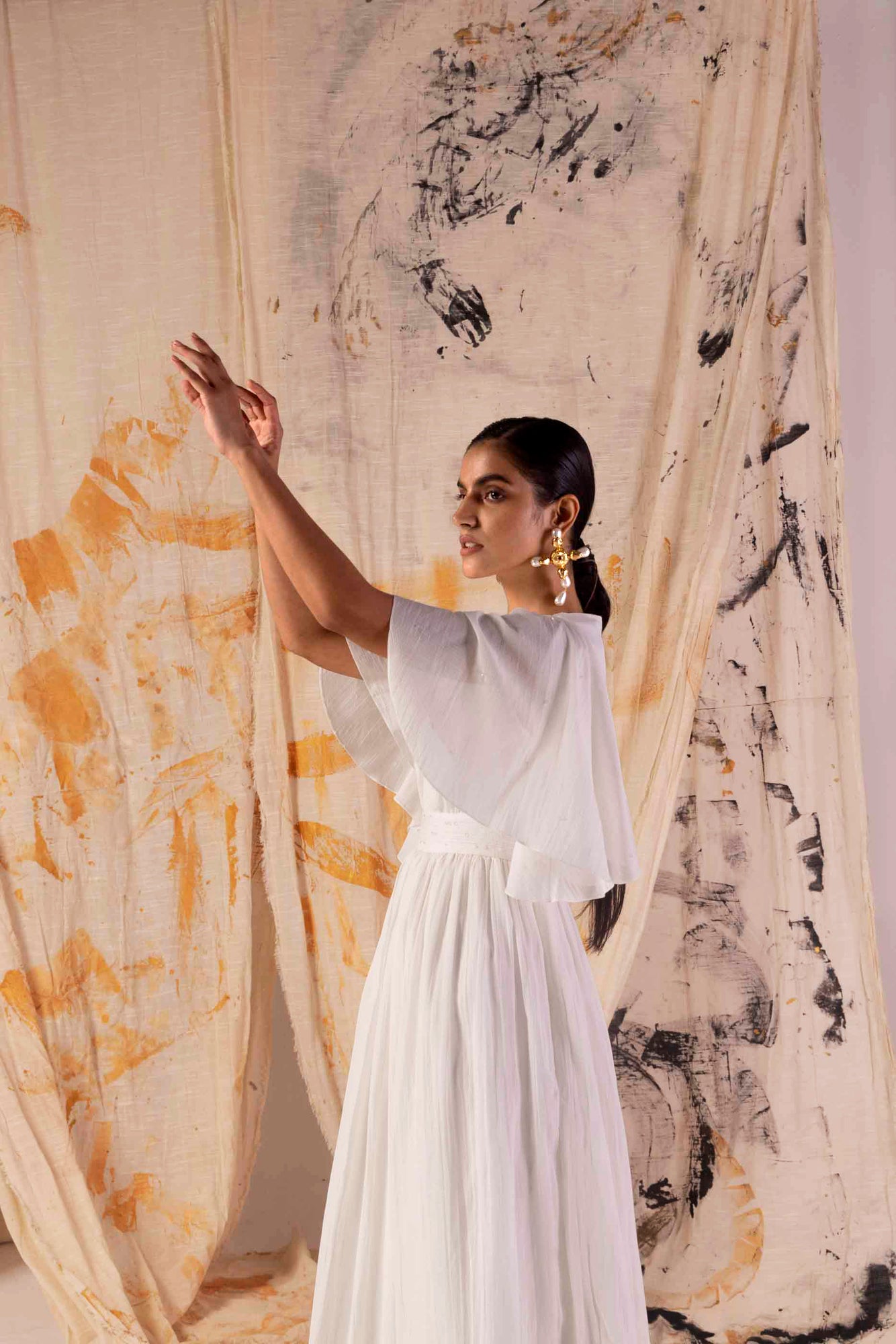 Elegant Valencia Fluid Dress in rich, handloom fabric; showcases a flowing silhouette, epitome of luxury womenswear craftsmanship